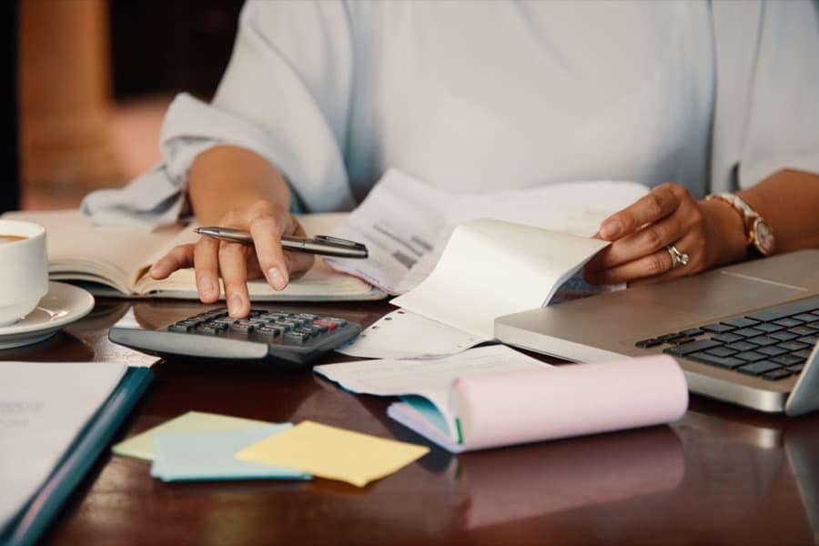 Invoicing with a calculator in hand